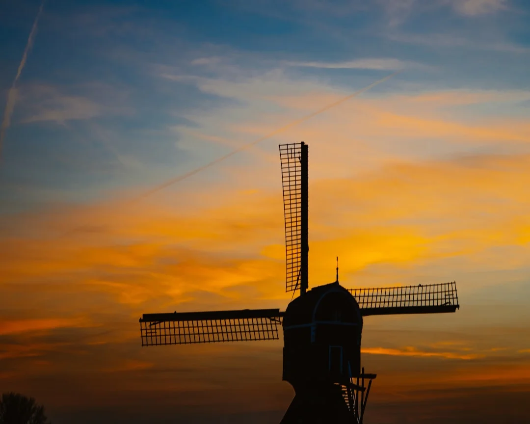 Dutch old vintage Windmill during sunset