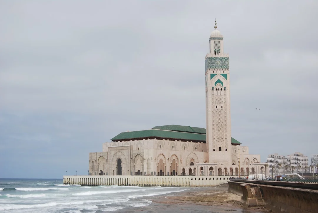 Hassan ii mosque on a cloudy day by the ocean